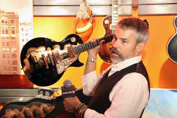 Gibson Custom Artist in Residence, James A. Willis, holding the one-of-a-kind Midnight City Special, interviewed by Guitar Shop TV